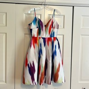 Sundress sweetheart cut with adjustable straps/full skirt.  Above knee.  Small